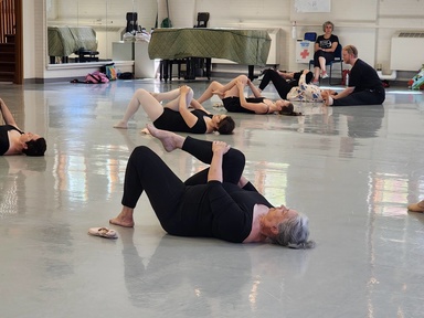 Adult students in floor barre