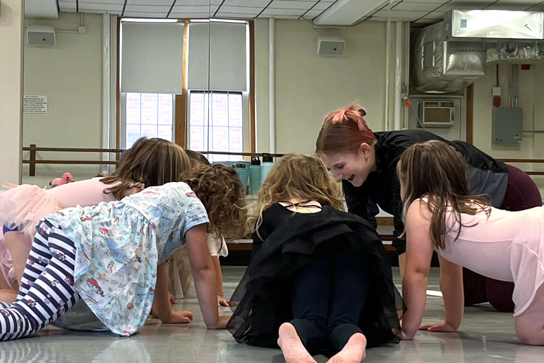 Young dancers crawl to a circle