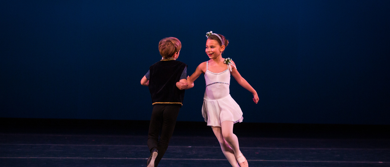 young dancers performing on stage
