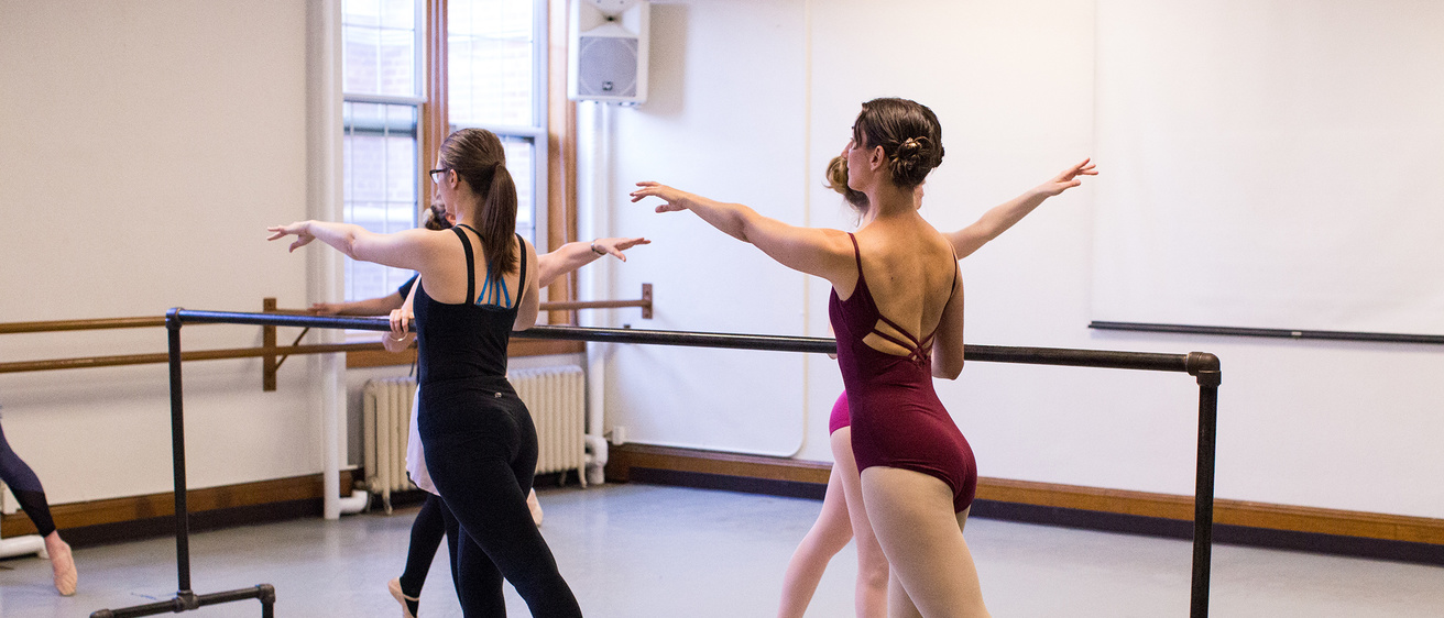 adult dancers warming up in a studio